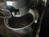 a mixer that is sitting on a counter in a kitchen
