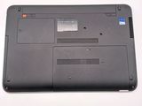 a black laptop with a red button on it