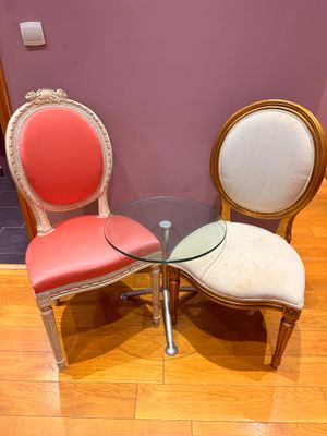 two chairs and a table in a room