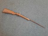 a rifle that is laying on the floor