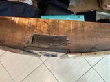 a wooden boat that is sitting on the floor