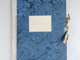 a blue and white book with writing on it