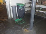 a trash can sitting next to a trash can on the floor