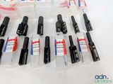 a lot of different types of ink pens on the table