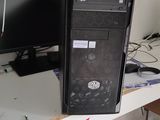 a desktop computer sitting on a desk in a room