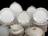 a lot of plates and bowls that are stacked together
