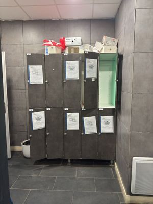 a photo of a bathroom with a bunch of lockers