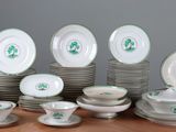a lot of plates and cups on the table