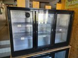 two refrigerators that are sitting on top of each other