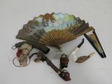 a fan, pipe, and other items on a table