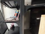 a desk with a chalk board on it and a chalk board on the shelf