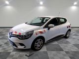 the white car is parked on a checkered floor in the garage
