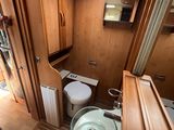 a bathroom with a sink, toilet, and shower in it
