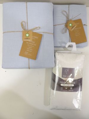 two boxes of towels and a bag of flour on a table