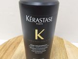 a bottle of kerastasee sham on a wooden table