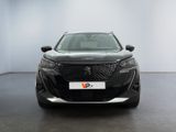 the front view of a black car in a white room