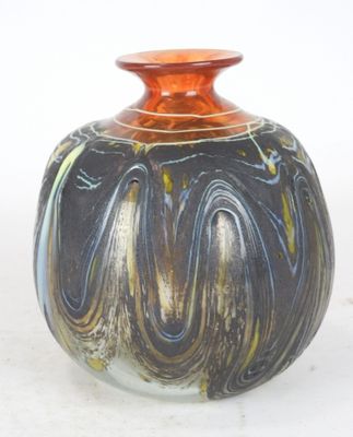a vase that is sitting on a white surface