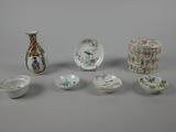 many different pieces of porcelain sitting on a table