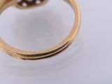 an image of a gold ring with a diamond on top of it