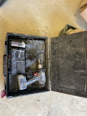 a box with tools in it sitting on the floor