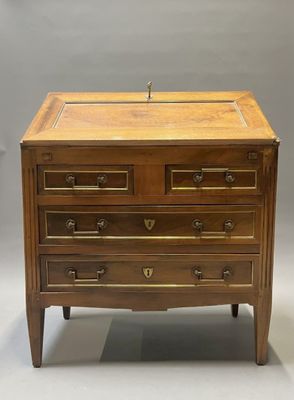 an antique wooden chest of drawers with brass handles and drawers