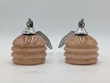 pair of salt and pepper shakers with a bee on top