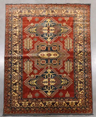 a red and blue rug with a design on it