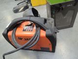 a machine that is sitting on the floor next to a box