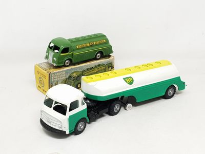 a green and white truck and a green and white bus
