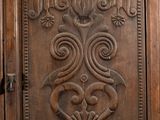 an image of a wooden door with a decorative design on it