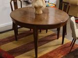 a table with a vase on top of it in a living room