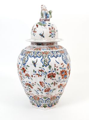 an image of a white and blue vase with a lid
