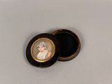a small black box with a picture of a woman on it