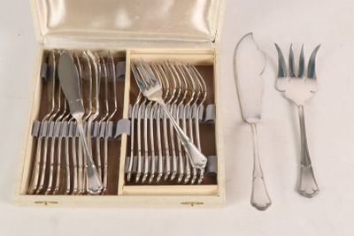 a box with silverware in it on a white surface