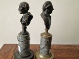 pair of antique bronze busts of a boy and a girl on marble bases