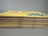 six children ' s books stacked on top of each other on a table