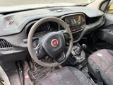 a dirty dashboard and steering wheel of a small car