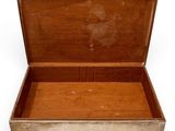 a small wooden box with a handle on a white background