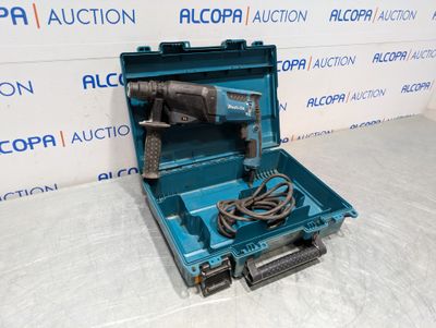a blue tool box with a cord and a drill in it