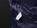 a close up of a blue dress with a label on it