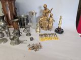a lot of silver and gold items on the table