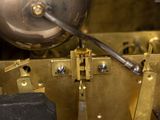 a close up of a clock that is being worked on