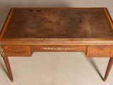 an old wooden desk with a leather top and two drawers