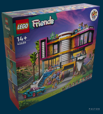a box of lego friends set with a car in front of it