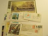 a lot of postcards and stamps on the table