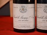 two bottles of wine that are sitting on a table