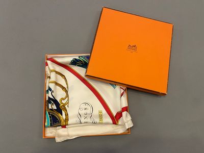 an orange box with a white scarf and a yellow box with a picture of a woman on it