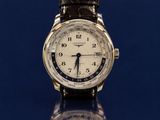 a close up of a wrist watch on a reflective surface