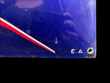a blue sign with a red stripe on it
