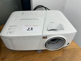 an image of a projector sitting on top of a wooden table